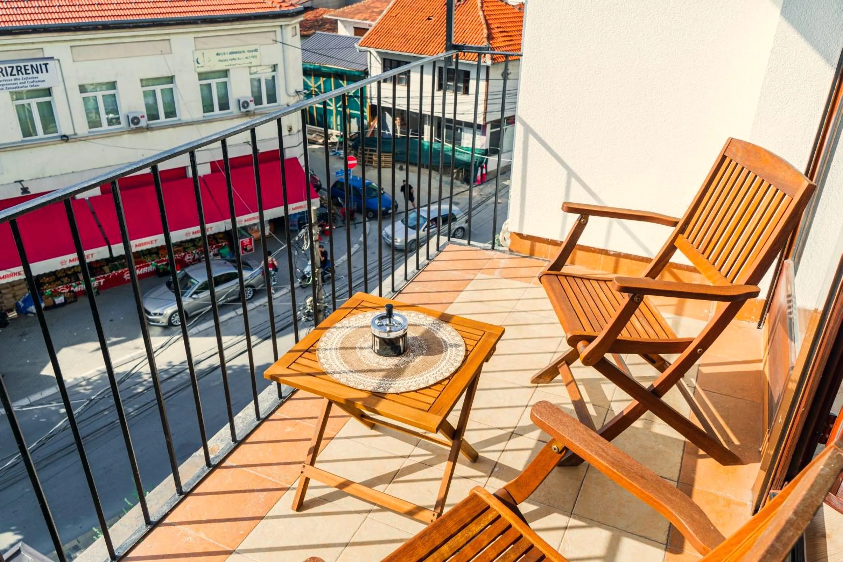 Wooden chairs on the balcony overlooking the old town
