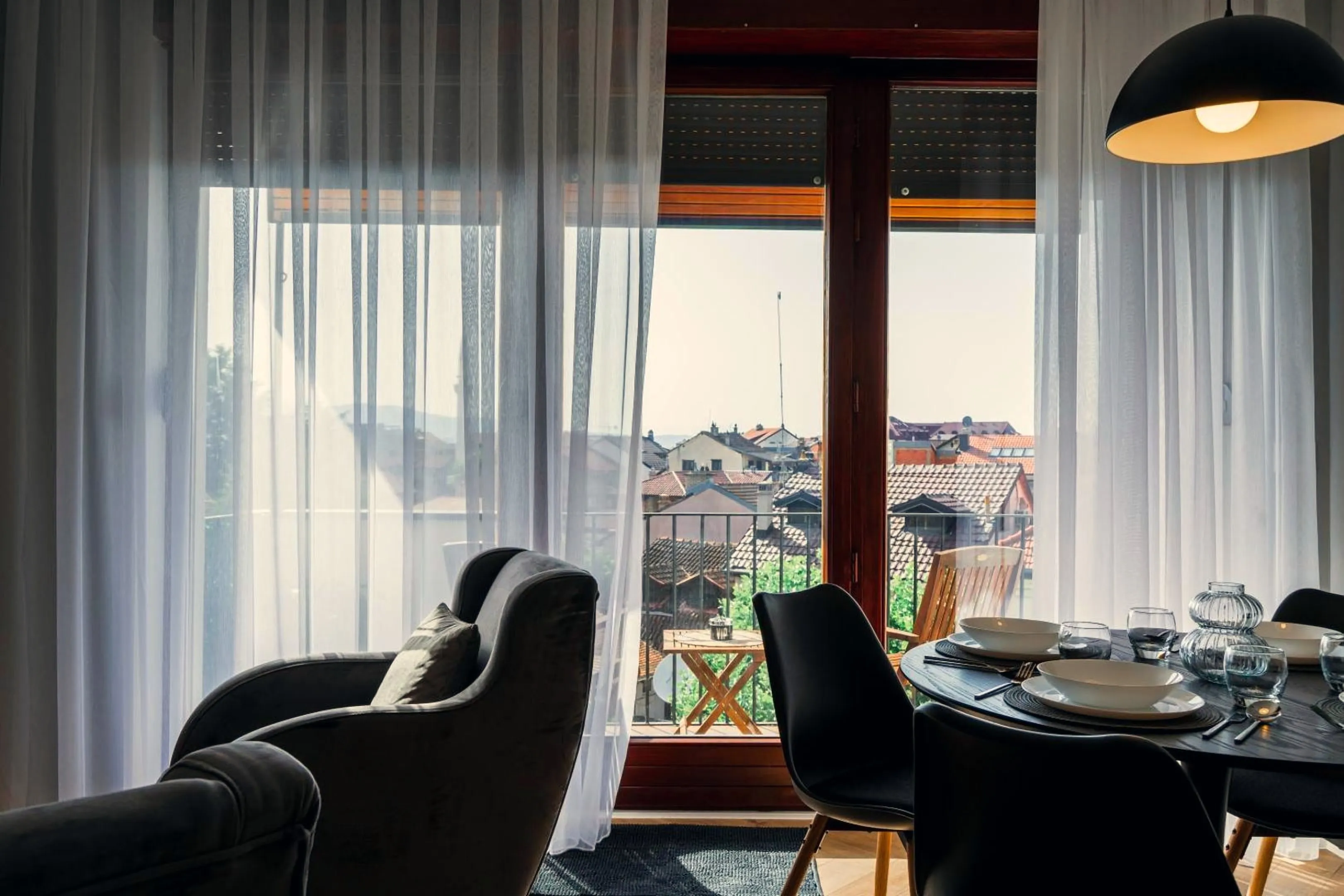 The dining table by the balcony door