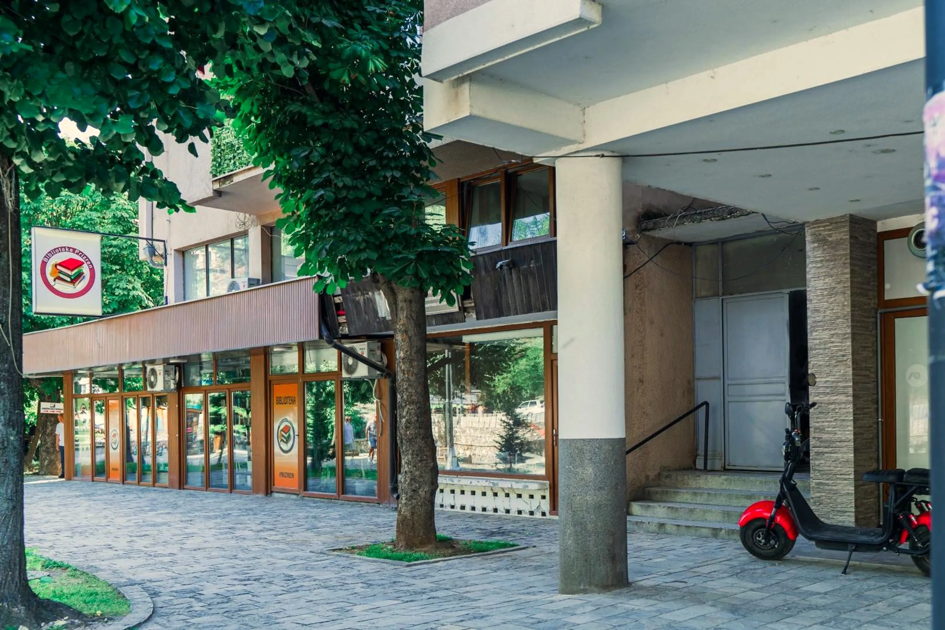 The parking area beside the building